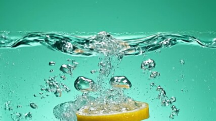 A lemon slice creating water ripples and splashes in a teal background - Powered by Adobe