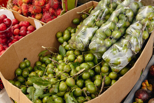 Exotic Latin fruit mamoncillo bunch at a local street food stall
