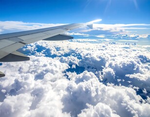 Obraz premium Aerial View of Airplane Wing and Clouds on a Sunny Day.