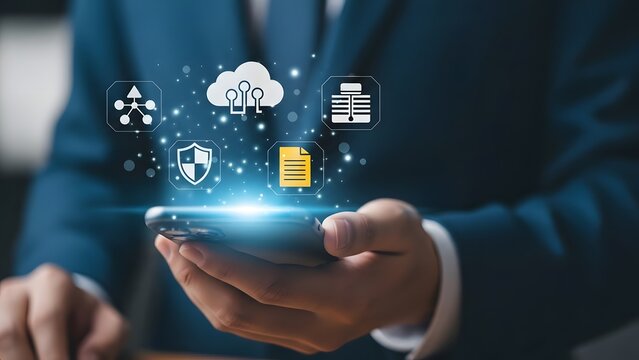 Businessman holding smartphone with cloud computing and data management icons displayed