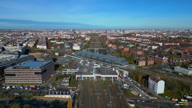 Berlin Tempelhof urban cityscape showing modern train station South Cross, railway tracks. speed ramp hyper motion time lapse Perfect aerial view flight panorama orbit drone