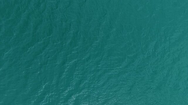 Calm turquoise water in Switzerland evokes tranquility and peace