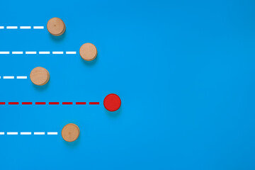 red wooden blocks race to other wooden blocks. isolated on blue background. concept of business competitive or leadership