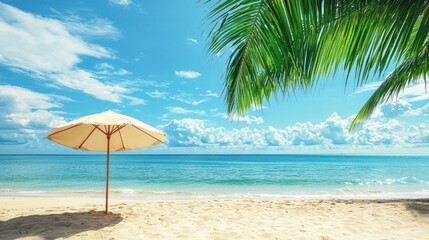 Fototapeta premium A white umbrella with a beige canopy stands on a sandy beach under a clear blue sky with fluffy white clouds.