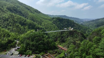 Glass suspension bridge across the valley