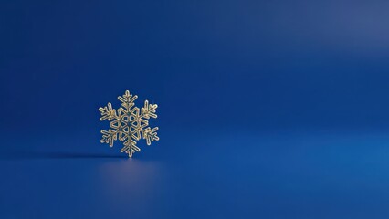 A single golden snowflake on a blue background.