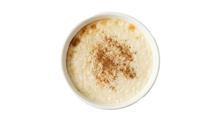 PNG cut out isolated background. A high-angle studio shot of a white ceramic bowl filled with creamy baked rice pudding, also known as Turkish Sutla&ccedil; or Arroz con Leche.