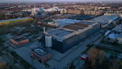 Large data center building processing information and connecting global network infrastructure. Unique aerial view flight panorama overview drone - Powered by Adobe