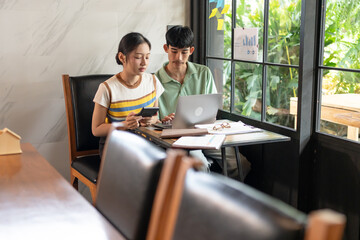 Asian Office Workers Collaborating in a Business Meeting.