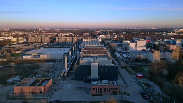 Large data center building processing information and connecting global network infrastructure. Amazing aerial view flight drone shot from above