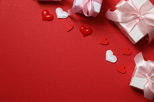 Valentine's Day card with hearts, on a red background.
 - Powered by Adobe