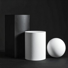 Simple geometric objects on dark surface in studio