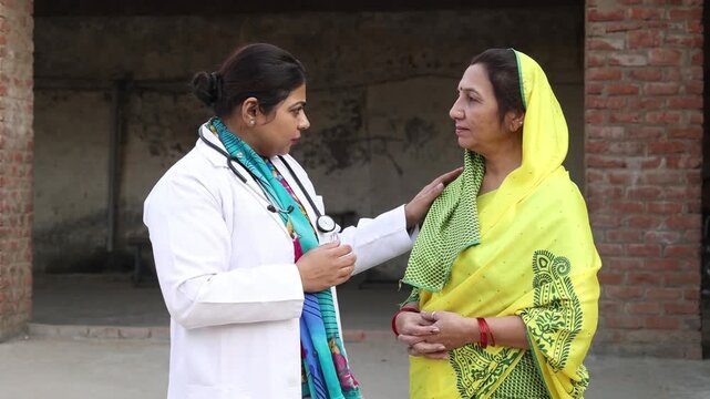 Female doctor consulting rural Indian woman. Healthcare professional spread health awareness in india. Village people get medical support. Government scheme.