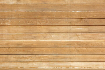 Fototapeta premium A wooden wall with a grainy texture