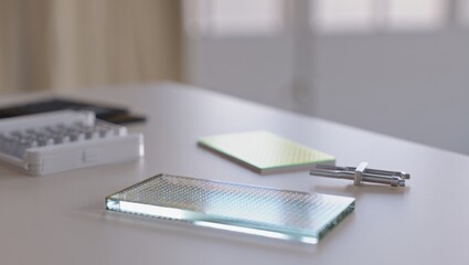 Microfluidic chip glass slides arranged on a clean lab bench for analysis