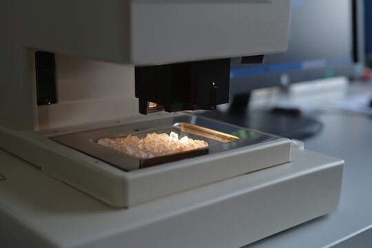 Raman spectrometer workspace crystal-laden sample stage for analysis inside lab