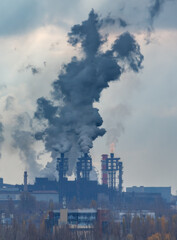 A large factory with smoke coming out of it