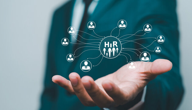 A businessman's hand in a suit gestures to present a digital human resources (HR) icon at the center, connected via lines to multiple employee avatars, symbolizing modern networking and talent managem