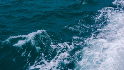 Ocean waves crashing, forming a beautiful pattern of the sea surface