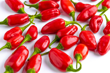 Vibrant red jalapeno pepper on a white background with space for text, ideal for food and culinary concepts.Group of ripe red jalapeno peppers .