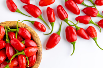Vibrant red jalapeno pepper on a white background with space for text, ideal for food and culinary concepts.Group of ripe red jalapeno peppers .