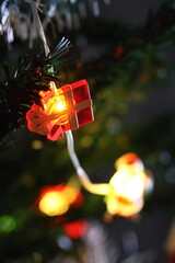 christmas decoration on christmas tree with lights and color bokeh