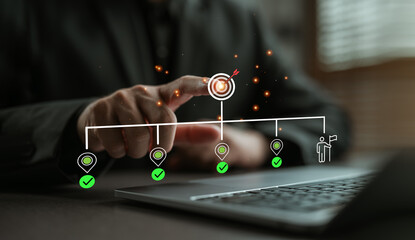 Businessman pointing at target icon on virtual roadmap interface. Concept of business planning,...