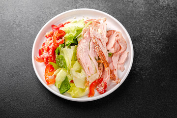 Healthy turkey and vegetable salad in white bowl for diet or fitness meal concept