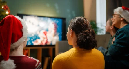 Fotobehang Muziek family watching holiday movies at home  © Konstantin Yuganov