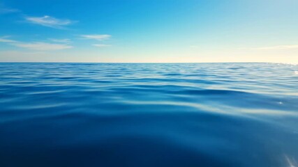 Infinite Horizon: The serene expanse of ocean meets a clear, cloud-dotted sky, inviting contemplation and offering a sense of boundless freedom.