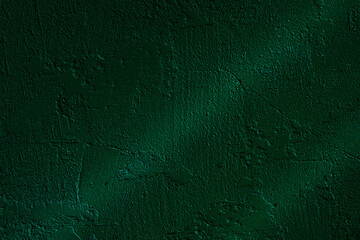 Dark green stucco wall with dramatic light and textured shadow lines