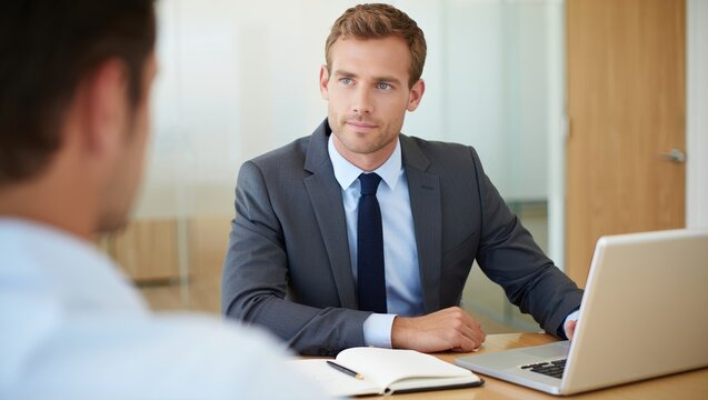 Professional financial advisor facing camera in a modern consultation space