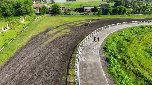 Rider enjoys horseback riding around the track at Sultan Agung Stadium in Bantul, Yogyakarta