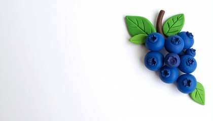 Colorful blueberry cluster made from clay on a white background