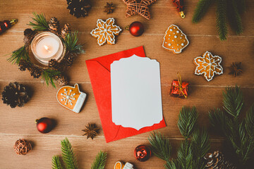 Christmas cookies and candle with empty card on wooden table background festive winter holiday arrangement