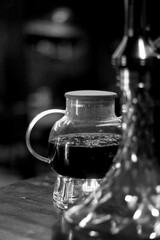  Coffee pot on a wooden surface with blurred background