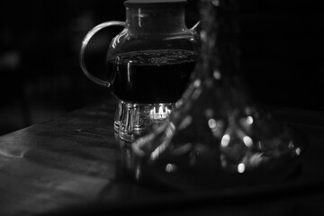 Tea pot on a wooden surface with blurred background