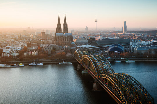 Bridge and city skyline at sunset, Cologne, Germany