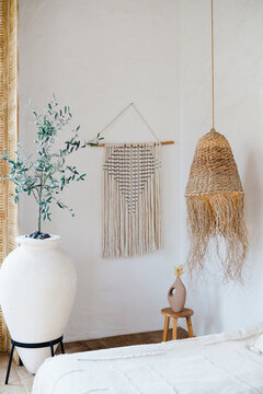 Bohemian decor natural woven pendant light macrame wall hanging large vase and potted plant