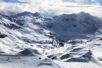 View of ski slope in Obertauern resort, Austria. Mountain winter panorama landscape in Alps.