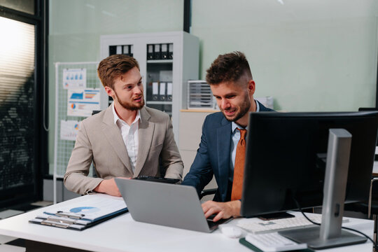 businessman collaborate on project analysis with financial graphs.