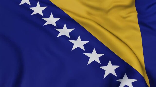 Bosnia and Herzegovina national flag is waving or flying in close up