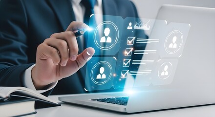 Businessman interacting with holographic interface on laptop for recruitment process