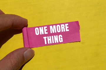 One More Thing message written on ripped torn paper background. Conceptual One More Thing symbol. Copy space.
