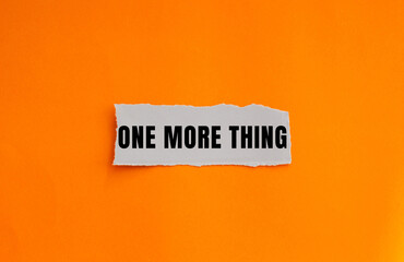 One More Thing message written on ripped torn paper background. Conceptual One More Thing symbol. Copy space.