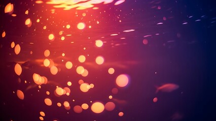 Vibrant abstract underwater scene with shimmering light rays and floating bokeh particles creating a magical gradient of red, orange, and deep blue