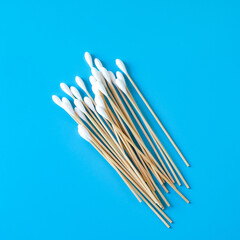 A swab clean health care top view,cotton bud on blue background.