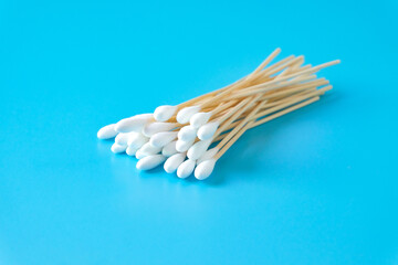 A swab clean health care top view,cotton bud on blue background.