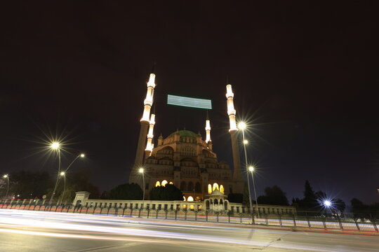 Adana Sabancı Central Mosque at Night with Projected Islamic Text