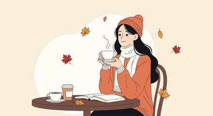 A smiling young woman enjoying a warm drink and reading a book at an outdoor cafe during a cozy autumn day with falling leaves.
